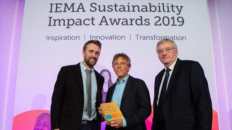 This picture shows how Paul Eissen, business owner of iReport receives the IEMA Sustainability Impact Award. If you follow the link attached to this image you will go to the original news article about this win.